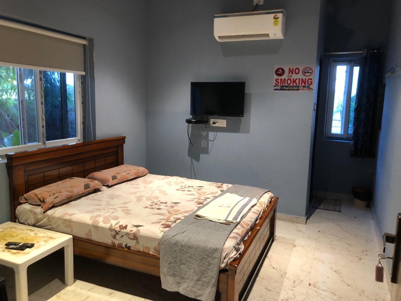 AC room with double bed and TV